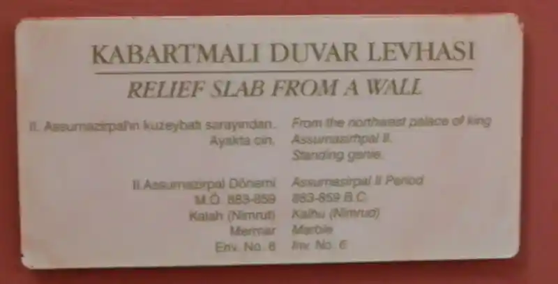 Relief slab from a wall, winged man - standing genie